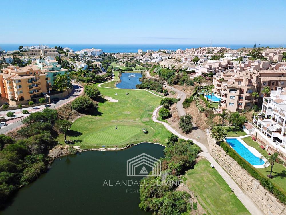 Frontline golf apartment in Riviera del Sol with interior and exterior pools and tennis court!